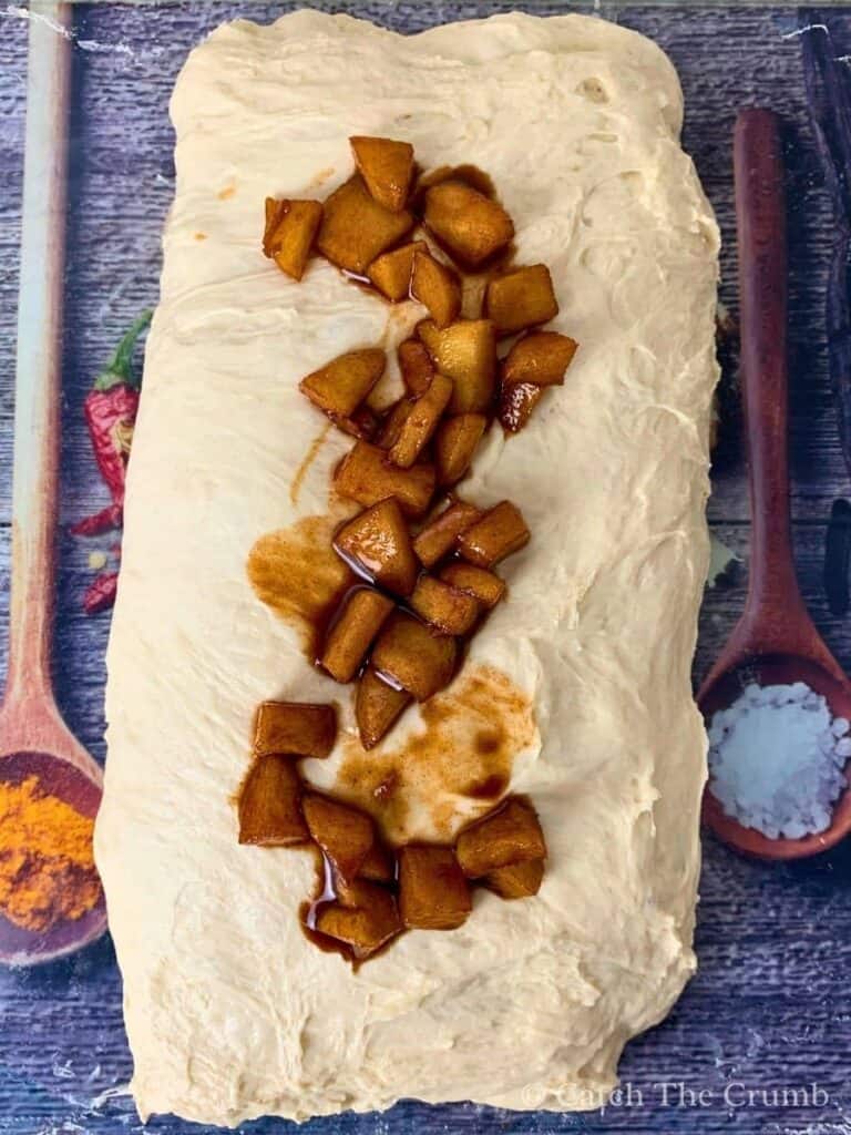 apple filling spread over the top of the folded dough