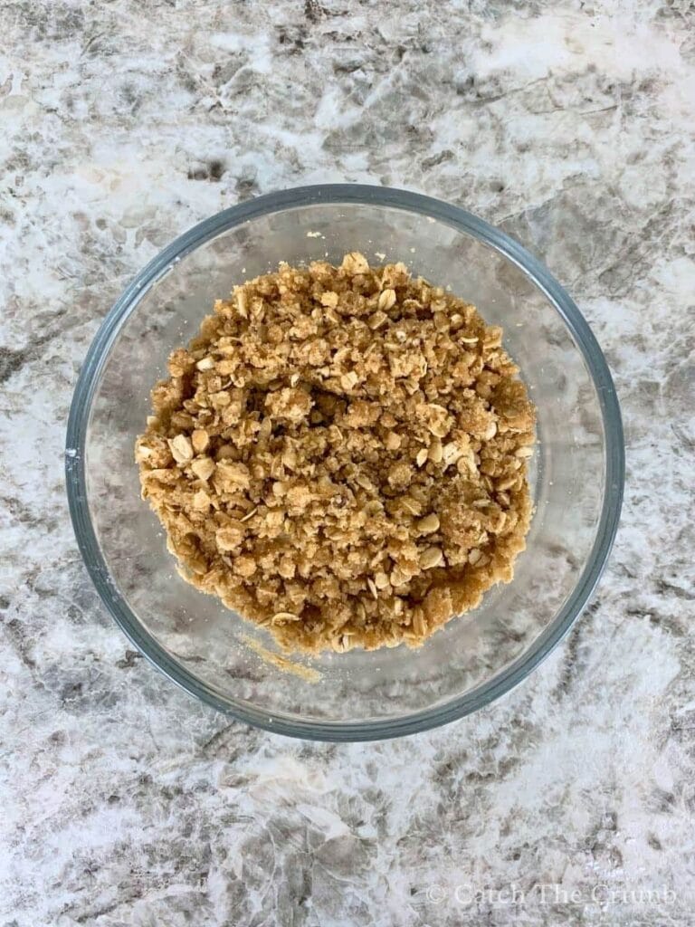brown sugar, oats, flour, and cinnamon combined in a mixing bowl