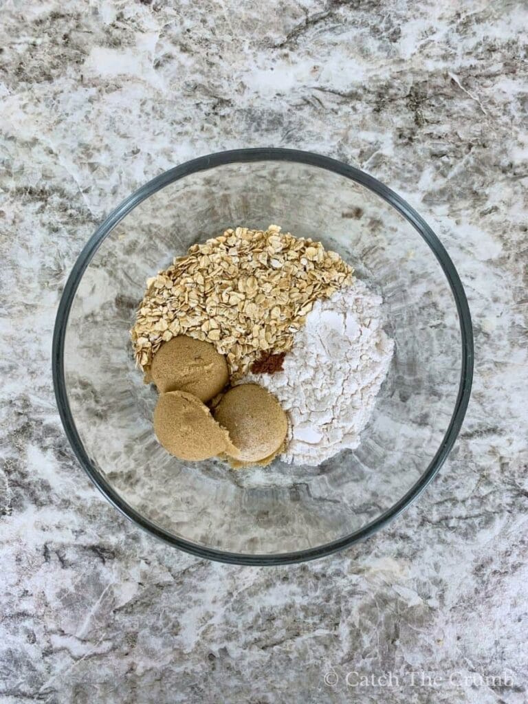 brown sugar, oats, flour, and cinnamon in a mixing bowl