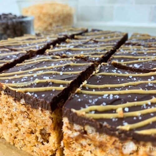 peanut butter and chocolate rice krispies bars cut into squares sitting on a countertop