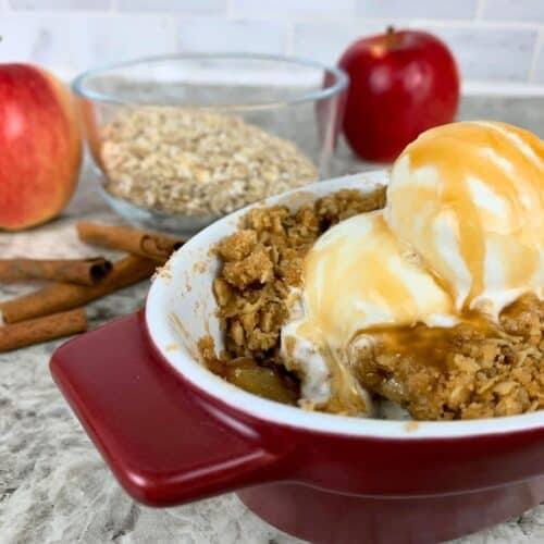 single serve apple crisp with vanilla ice cream and caramel sauce