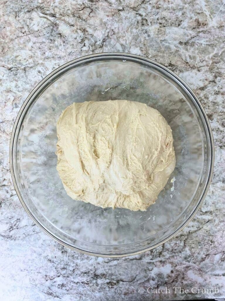 stretched and folded dough in a mixing bowl