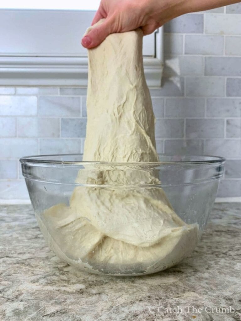 stretching dough upwards