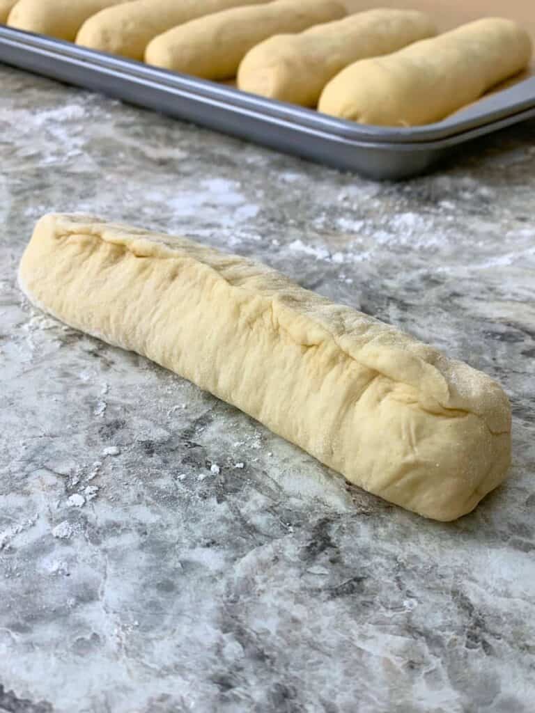 Pinching the seam and both ends to seal