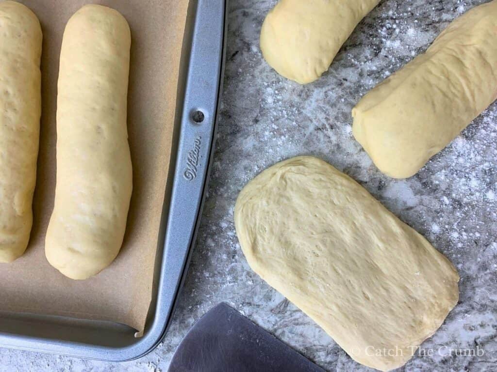 dough flattened into a rough 6x3-inch rectangle