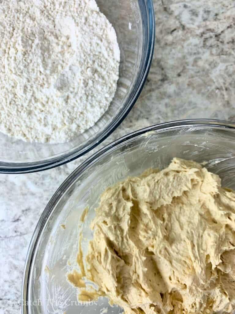 flour, baking soda, and salt in a mixing bowl and butter, white sugar, brown sugar, egg, and vanilla mixed together in another mixing bowl