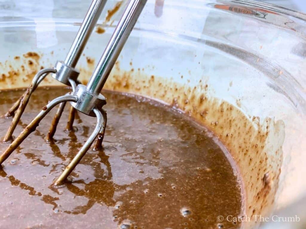 mixing the milk and hot water into the mixture