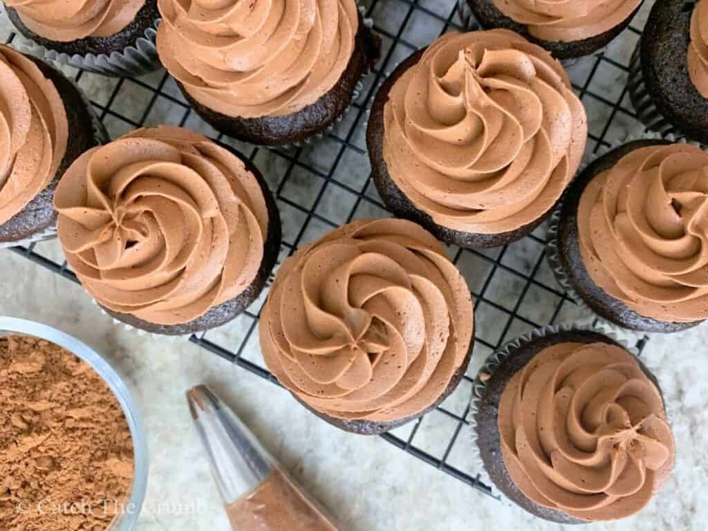 sourdough chocolate cupcakes sitting on a cooling rack