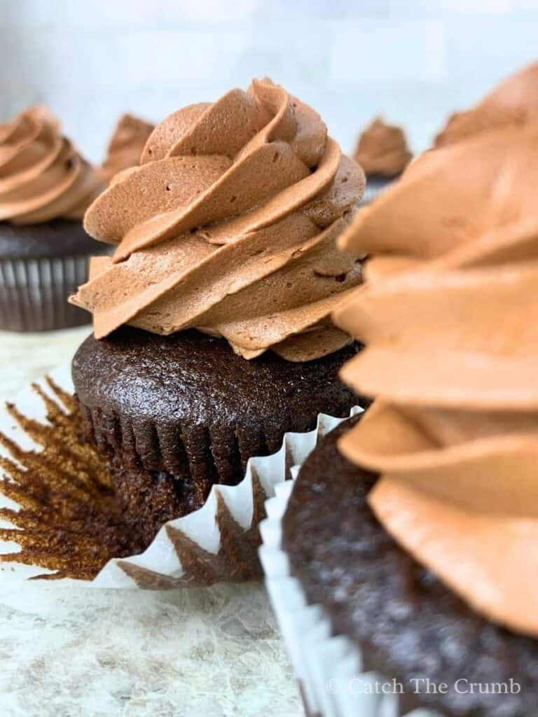 sourdough chocolate cupcakes with the liner being pulled off