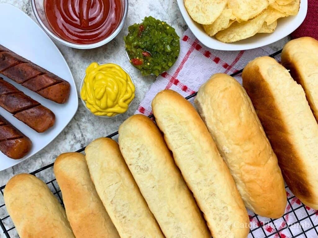 sourdough discard hot dog buns served with chips, ketchup, mustard, and relish