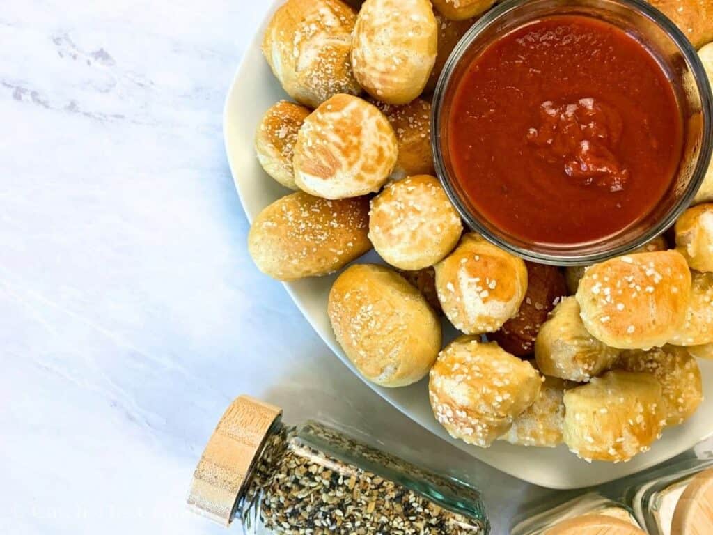 sourdough discard pretzel bites with pizza sauce and everything bagel seasoning