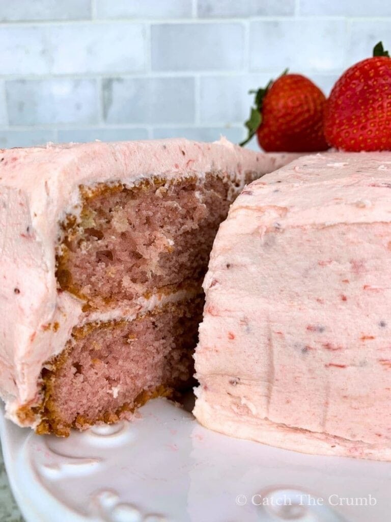 sourdough strawberry cake with a slice cut out