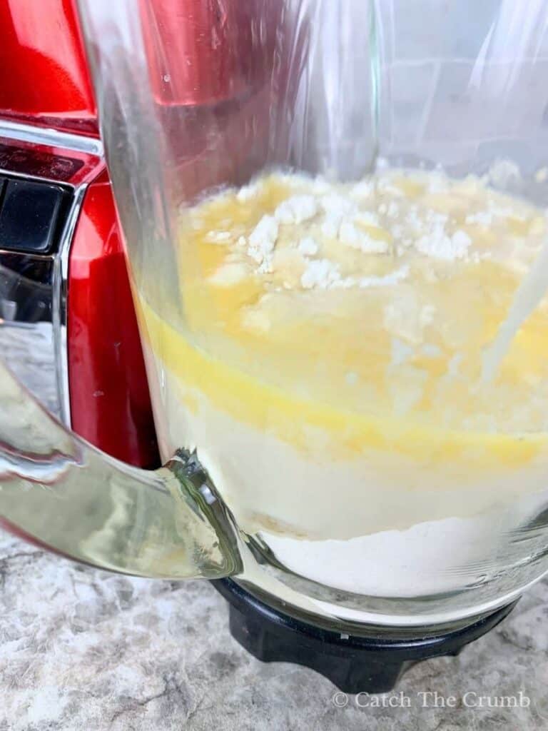 the ingredients being mixed in a blender