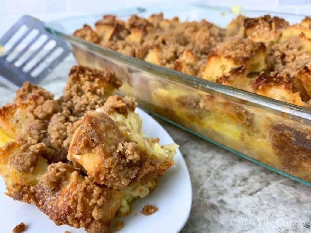 a slice of french toast casserole with sourdough bread on a plate