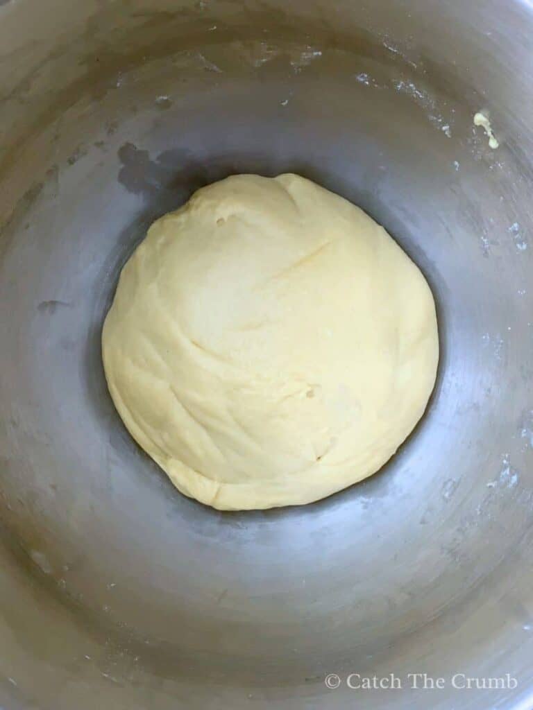 dough ball sitting in mixing bowl